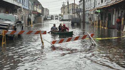 Idaho man goes canoeing down flooded street after heavy hailstorm left it choked with sheets of ice