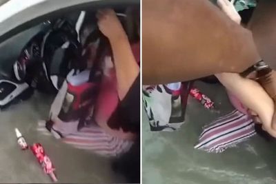 Race to rescue driver after car submerged in sinkhole
