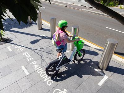 Sydney to get parking zones for shared ebikes in bid to stop ‘wild west scenes’ of blocked footpaths