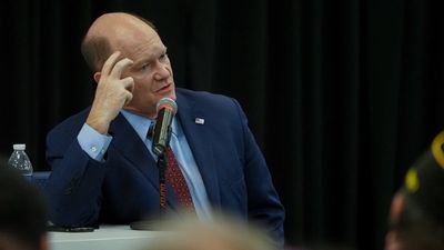 Pickup driver lost consciousness and struck several cars in Delaware. Sen. Chris Coons was a passenger in one of them