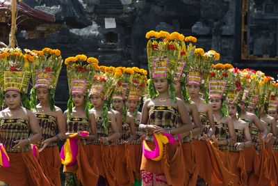 Photos show teen girls in Bali performing a sacred dance during a traditional Hindu ceremony