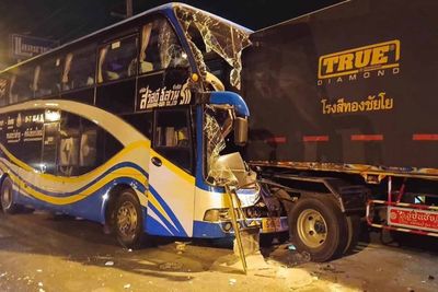 15 injured when bus hits parked truck