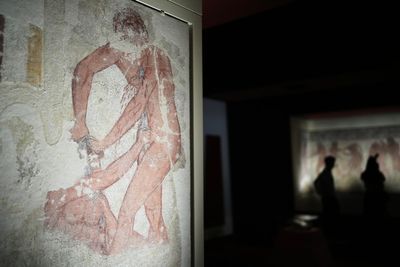 Italy displays paintings from an ancient Etruscan tomb, its latest cultural acquisition
