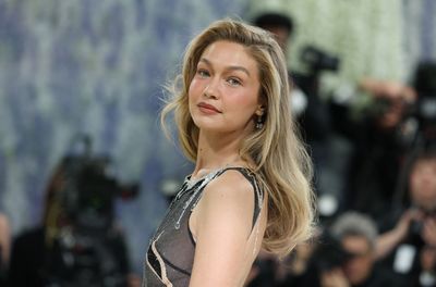 Steal Gigi Hadid's Airport Fashion Formula With Her Blue-and-Butter Layer Tee and Celebrity Style