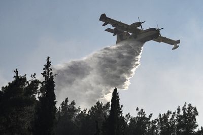 Two dead as wildfires gut house in northern Greece as village evacuated