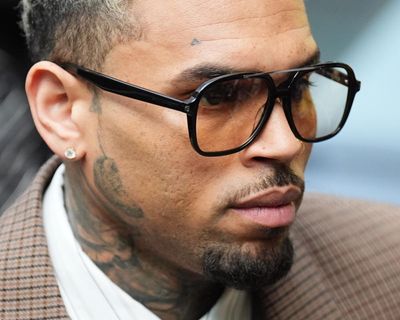 R&B star Chris Brown ordered to pay $13m to housekeeper mauled by his dog