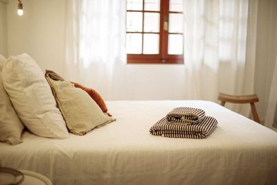 How to sleep in a heat wave without AC: Experts reveal when to stop using a fan and the simple bathroom hack that helps