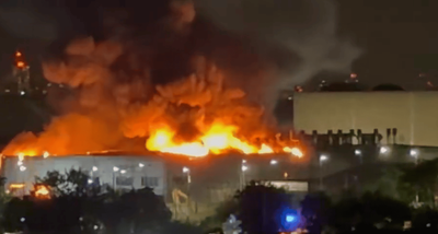 Tottenham fire: Huge blaze rages at Jaguar Land Rover service centre as 100 firefighters battle flames