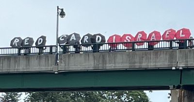 Protesters reveal 'Red Card Israel' display on Canada's closing World Cup day