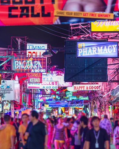 In Thailand’s sex tourism hub, bright lights flash, loud music blares – and underage girls are exploited