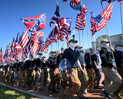 Hundreds of masked white nationalists march in Washington on Fourth of July