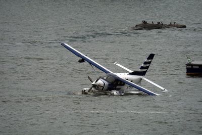 Eight people rescued after seaplane comes down in East River off New York City