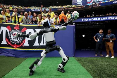 Meet the soccer-playing humanoid robot that just delivered the game ball at the Brazil v. Norway FIFA World Cup match