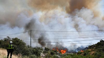 Tour de France bans spectators from third stage as fire burns in French Pyrenees