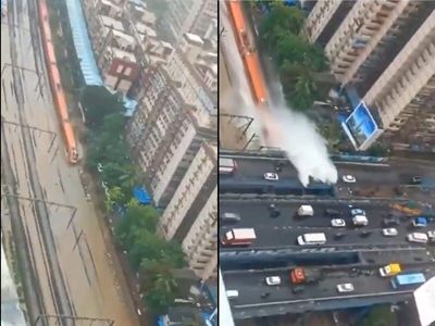 Amid Mumbai rains Vande Bharat seen running on tracks flooded water, splashing motorist on flyover above