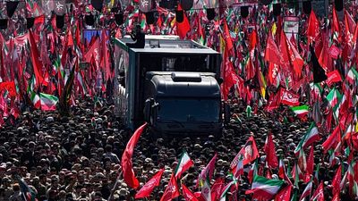 Ali Khamenei's coffin carried through the streets of Tehran