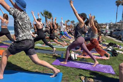 San Diego banned yoga classes at beaches and parks. An instructor known as ‘Namasteve’ is taking them to the mat