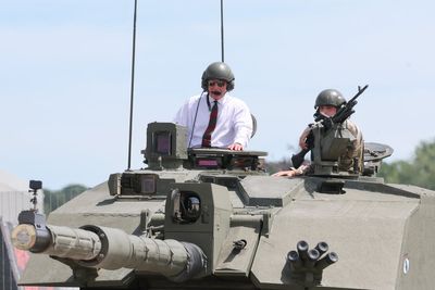 King Charles enjoys ride in British Army tank during regiment visit