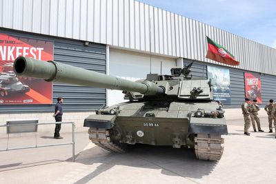 King Charles takes trip in a tank during British Army visit