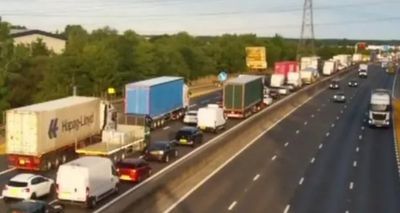 M25 traffic LIVE: Drivers face 13 mile queues and 110 minute delays after three lanes shut by vehicle fire