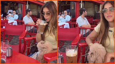 Woman reveals why she goes to the same cafe every morning. Then she zooms in on the $2 million wrist of the man sitting behind her