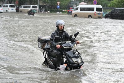 Landslide kills 21 people as storms and heavy rains wreak havoc in China