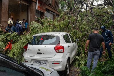 At least 16 people feared trapped after heavy rains collapse building in India