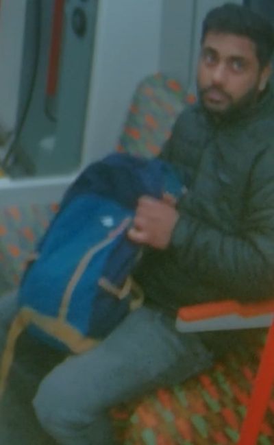 Police hunt man 'who stared at a woman and performed a sex act on a train' as CCTV image released