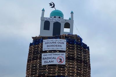 Police urged to act after replica of mosque placed on top of loyalist bonfire