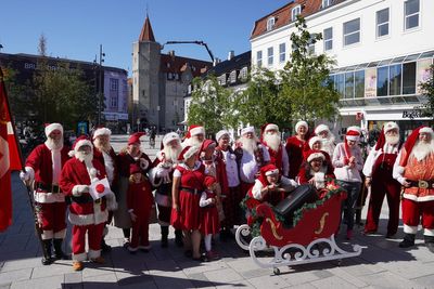 Christmas comes early as Santas gather for an unusual summer tradition