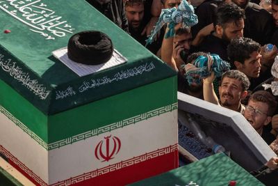 Iran says it hits US military targets in Gulf, lays slain leader to rest