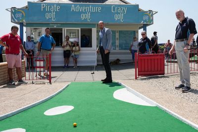 Prince of Wales plays crazy golf after ride on funicular