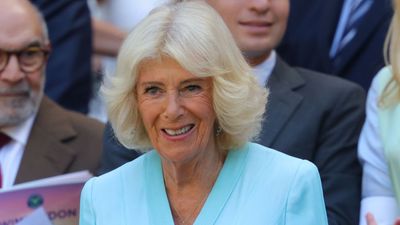 Queen Camilla beats the heat at Wimbledon and abandons royal tradition - her 'comfortable' cooling device can make a 'huge difference'