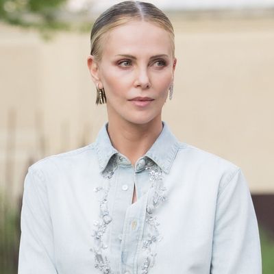 Charlize Theron Will Convince You To Pull This Anti-Summer Shoe Trend Out of Storage
