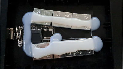Redditor buys suspicious drives on eBay just to report the scamming sellers if they get a fake SSD or HDD — latest '16TB' find has weights and microSD card hot-glued inside the enclosure to make it feel legit