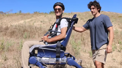 His father could no longer go where wheelchairs stopped. So he turned an industrial robot into a walking mobility chair