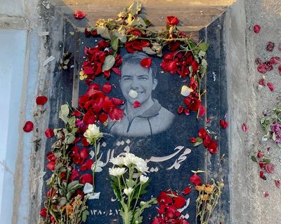 ‘They made us say he was a martyr’: families at Iran’s largest cemetery mourn those killed in the January protests