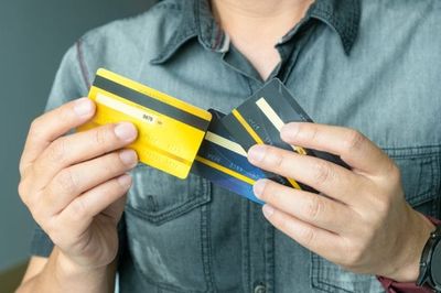 3 in 10 Americans Owe More on Credit Cards Than They’ve Saved — Here’s Which to Tackle Firs