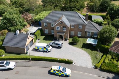 Man wanted over death of wife and daughters in Britain arrested in South Africa