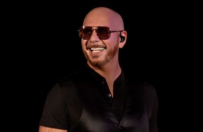 Pitbill breaks world cup bald record at London show