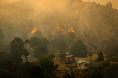 Rapidly growing wildfire in Los Angeles forces evacuations amid intense heatwave