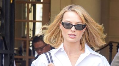 Margot Robbie's relaxed white shirt and jeans outfit formula is the timeless, A-lister look you can recreate on a budget