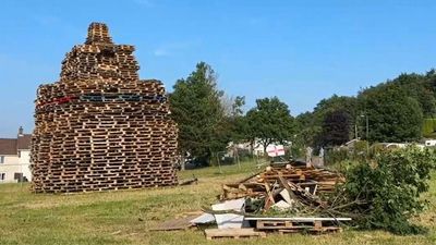 Belfast man dies after fall from Eleventh Night bonfire pyre; police launch probe