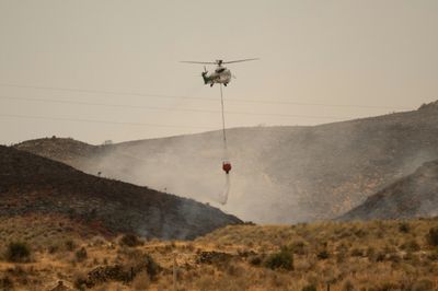 Evacuees allowed to return home after deadly wildfire in Spain stabilises