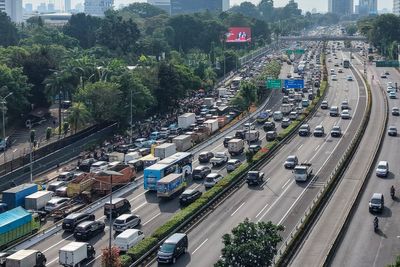 At least 13 killed after truck carrying wedding guests crushed on Indonesia highway