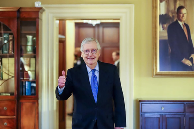 Mitch McConnell Photo Sparks Suspicion: No Tubes, No Wires, Just Jeans and a Newspaper