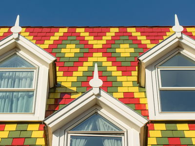 Most people never think about roof color, but Berkeley Lab found swapping a dark roof for a reflective "cool roof" cuts a building's annual air-conditioning energy use by 5–20%