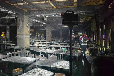Call for more law enforcement after Thai pub fire kills dozens