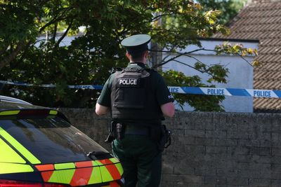 Police remain at the scene after three relatives found dead in family home