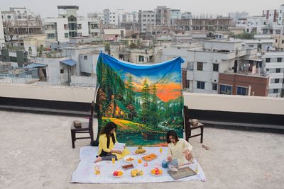 This contrasting scene of a countryside picnic on an urban rooftop won a major photography award – and now it’s your chance